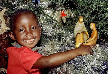 Burundi, Bujumbura, Kind am Weihnachtsfest